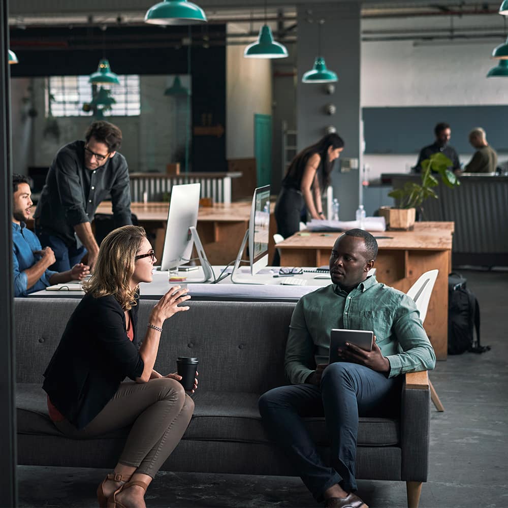 View of two people working on computer