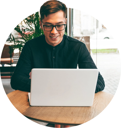 View of person using laptop computer