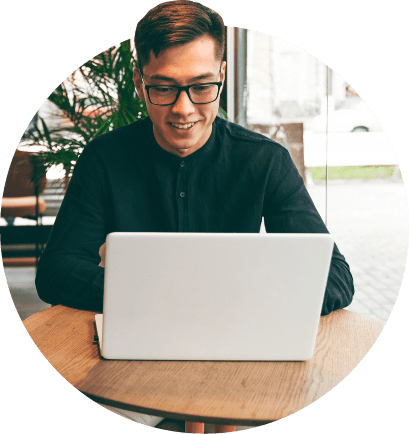View of person using laptop computer