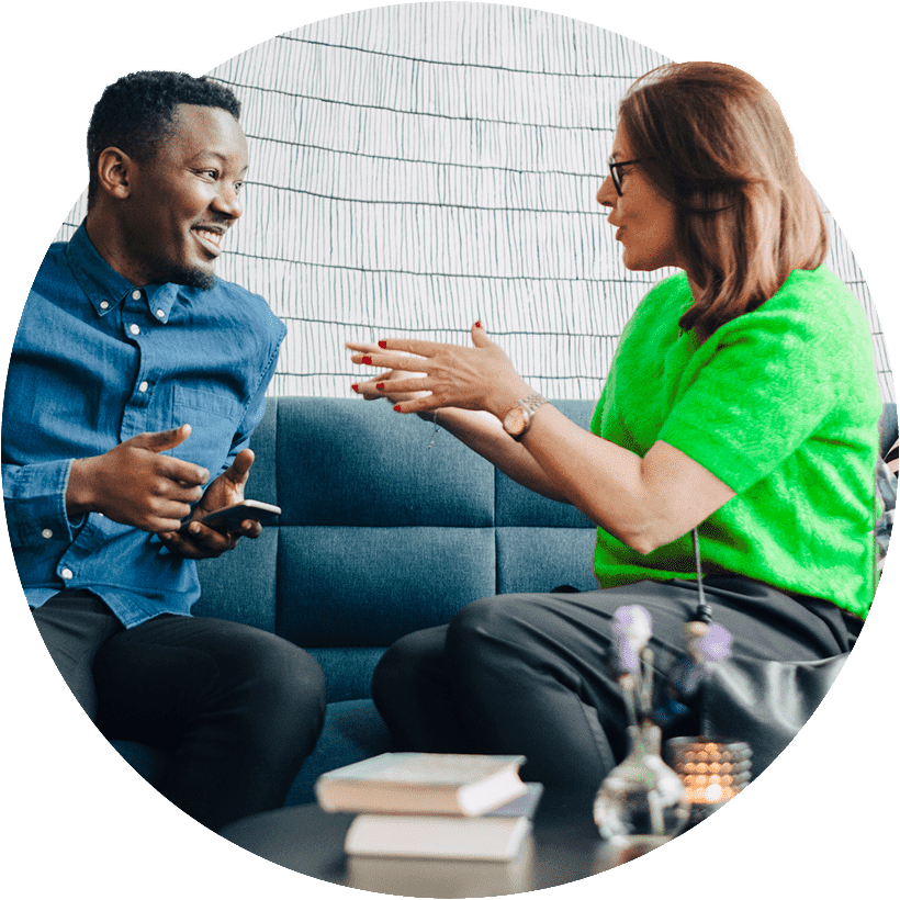 Man and woman sitting down and talking