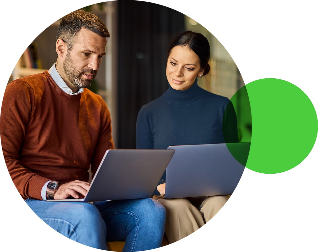 Two office colleagues looking at computer screen