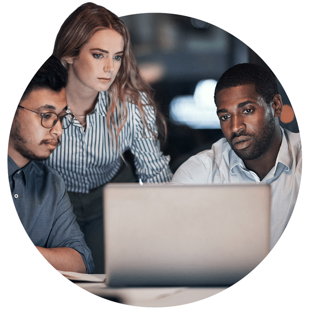 Three persons in front of a laptop computer