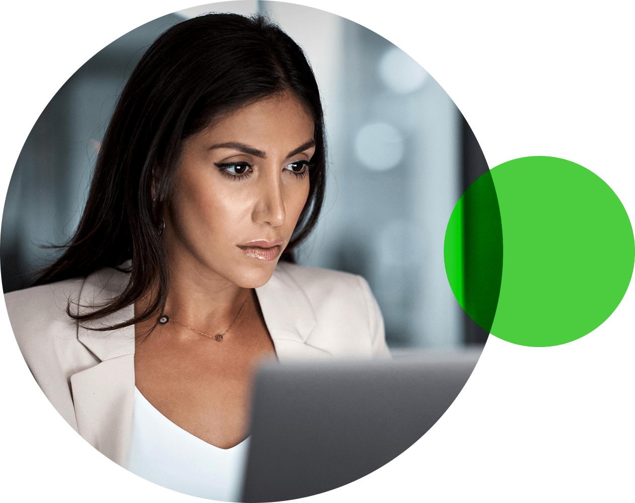 Woman wearing business suit looking at computer screen